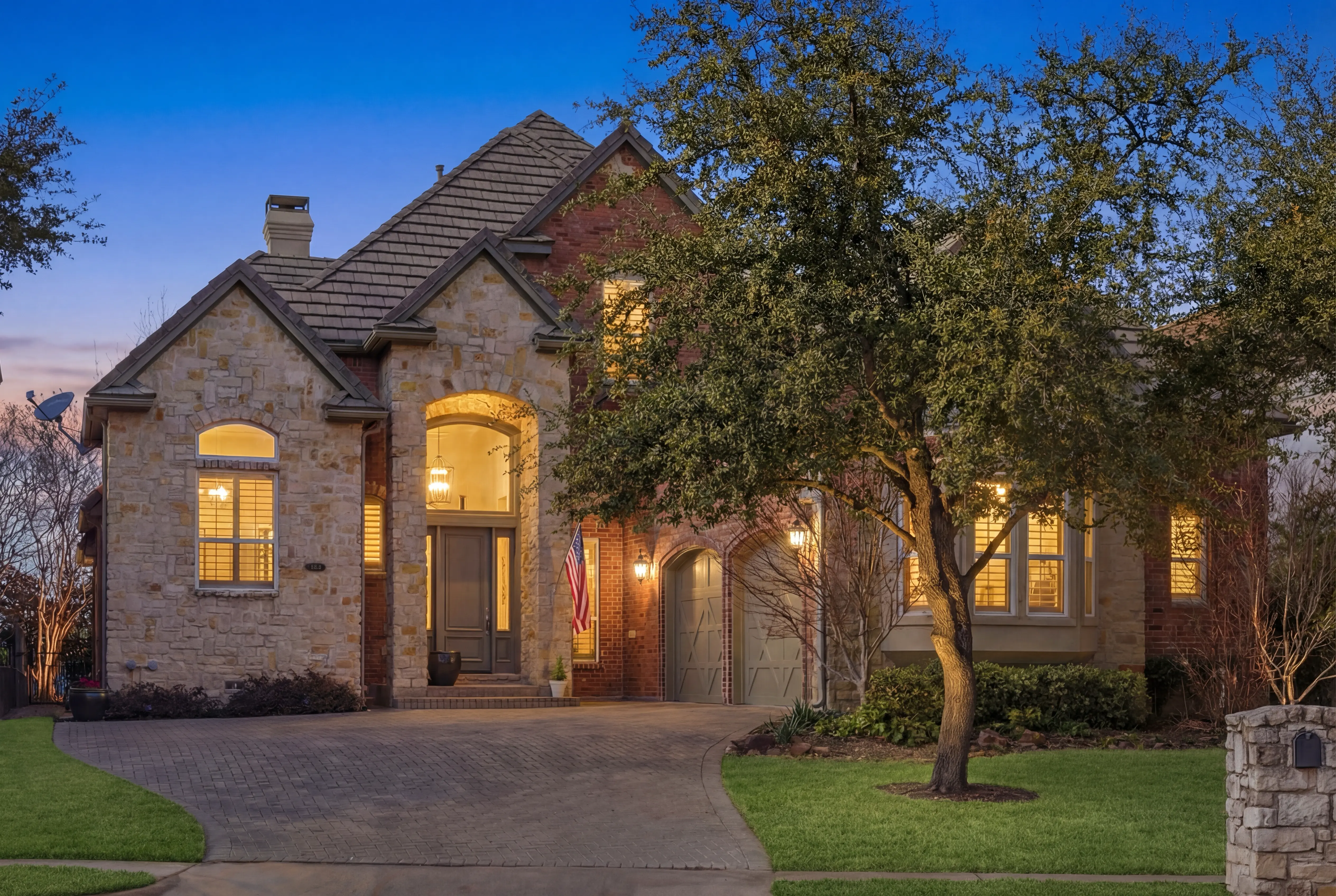 4335 St. Andrews Blvd - Luxury stone and brick estate at twilight in Fairway Vista, Las Colinas